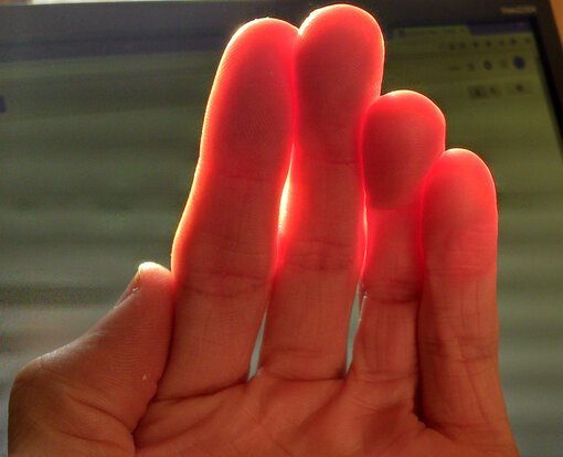 Subsurface scattering in the human hand. Scaled-down photo by Davepoo2014.